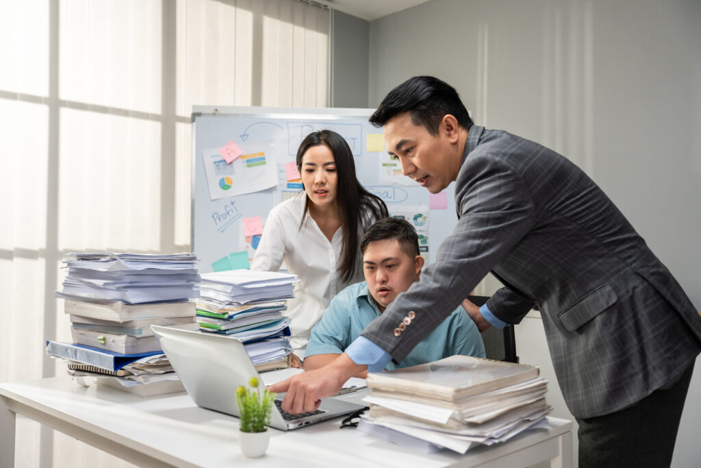 Asian young businessman patient work with manager in office workplace. Employee man worker people brainstorm planning and discuss project with executive businessperson. Corporate of modern colleague.